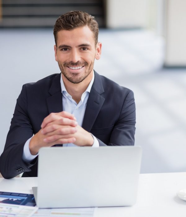 Businessman sitting with laptop Businessman sitting with laptop